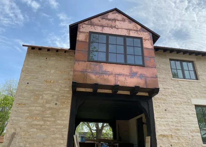 Copper metal panel facade on a stone building for Metal Roof Coating in Doral